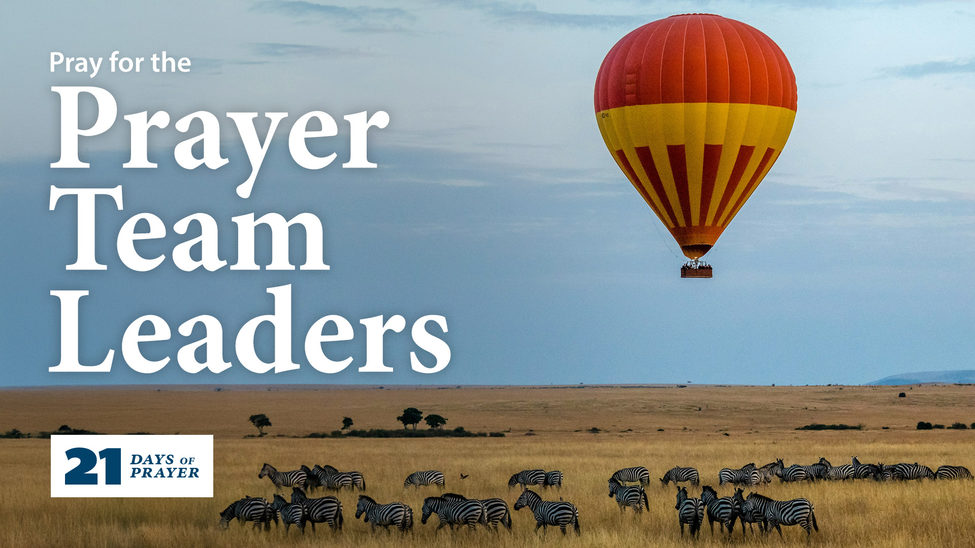 Zebras graze in an open field while a hot air balloon floats above. The type on the image reads Pray for the prayer team leaders